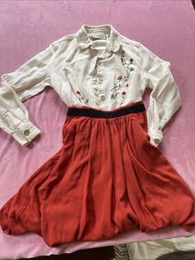 Embroidered Cream Button-Up Blouse with Rust Red Skirt